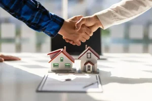 real-estate-agents-shake-hands-after-the-signing-of-the-contract-agreement-is-complete.